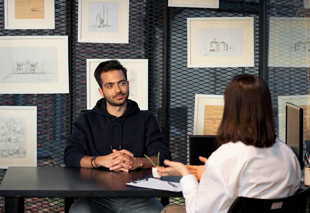 woman interviewing guest