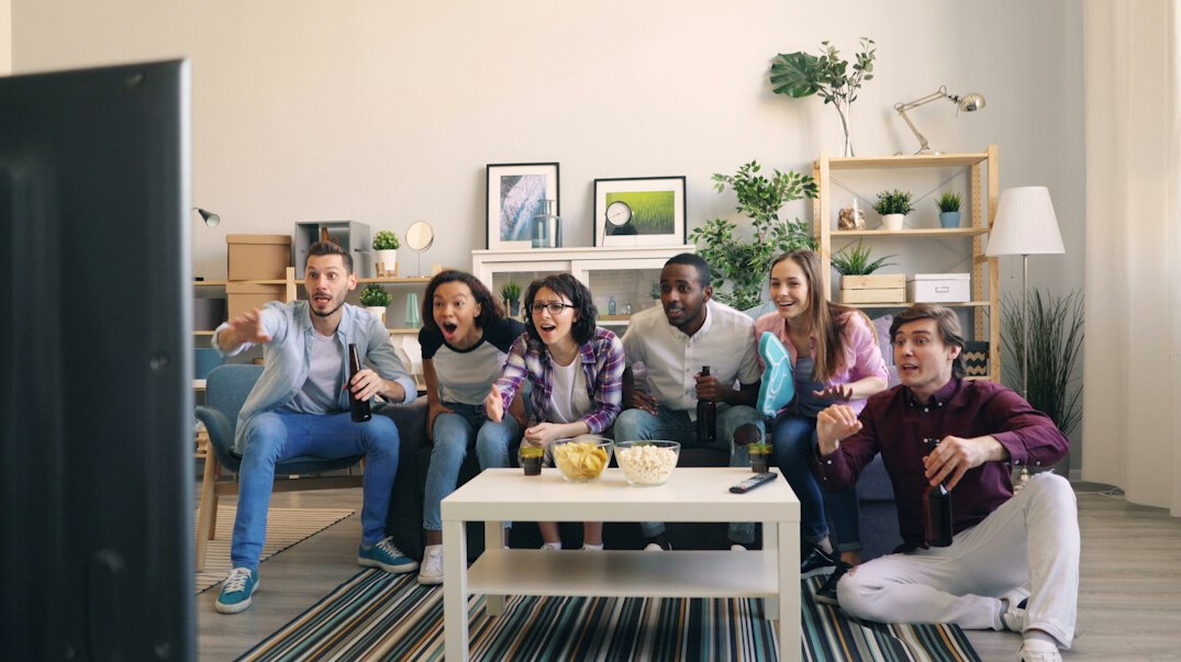 group watching 80s tv